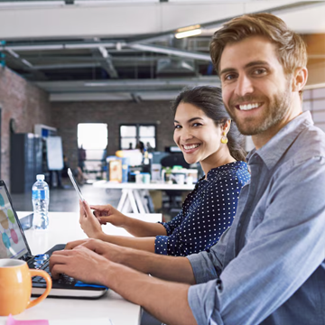 Team defining project requirements around a laptop